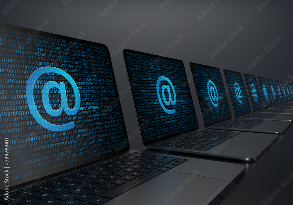 Aufkleber laptop devices lined up diagonally with at-sign address icon on their screens on a dark background. 