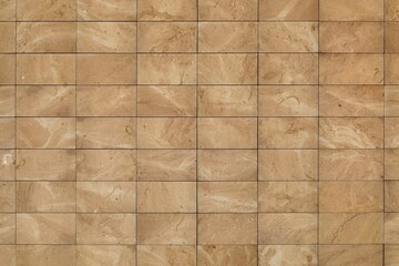 Rectangle brown stone tiles for ventilated facade cladding. Detail. Background and texture.