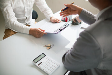 Real estate brokers are offering sample homes for customers choose from and recommending estate insurance promotions help protect their properties. Concept of offering real estate and home insurance