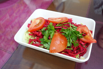 cabbage and tomato salad dish