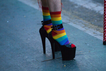 Detail of a drag queen's high heels with rainbow socks at the gay pride event for gay and LGBTQ...