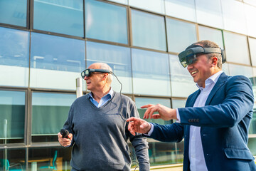 Senior and mature businessmen using the VR headset with actions