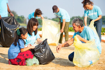 adult help children collect and separate plastic bottle for reuse,concept of environmental...