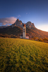 Seis am Schlern, Italy - Famous St. Valentin Church and Mount Sciliar mountain at background....