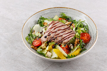 salad with meat, walnuts and oranges studio food photo 4
