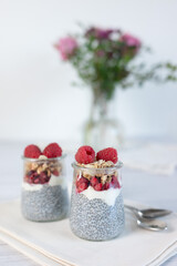 Home made chia pudding with granola and berries. Selective focus.