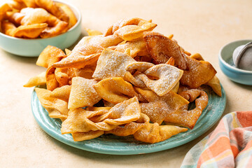 Angel wings or bugie, or chvorost; khvorost; faworki. Traditional sweet crisp pastry deep-fried and sprinkled with powdered sugar.