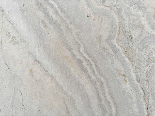 Smooth concrete surface featuring natural marbled details, blending organic and man-made aesthetics..