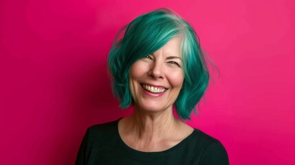 Fototapeta premium Smiling Woman with Teal Hair on Vivid Pink Background.