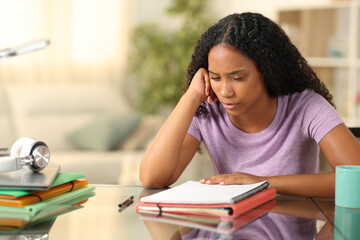 Black student studying memorizing notes at home - 739801243