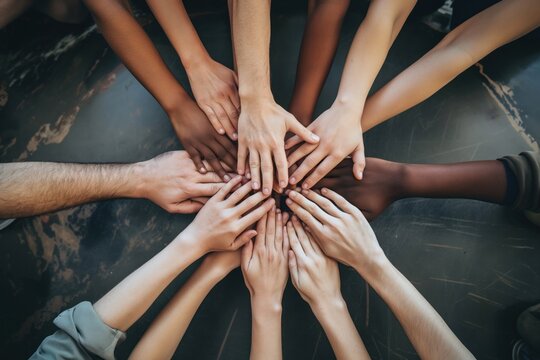 iverse hands coming together in unity on a neutral background
