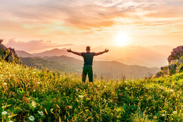 man doing hiking sport in mountains with anazing highland view