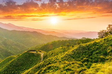 summer scenery mountain view from a highland hill to a beautiful sunset.