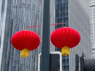 Chinese lanterns hanging in a town - 739811040
