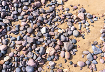 Colored Pebble Beach Texture Background, Sand and Rocky Shore Pattern, Red Morocco Beach, Africa