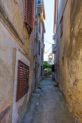 Fototapeta na wymiar An alley in the Stari Grad historic centre of the coastal town of Novi Vinodolski, Primorje-Gorski Kotar County, Croatia