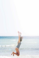 Woman Jumping Beach