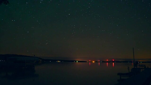 Burt Lake Northern up north Michigan night time lapse Timelapse evening cloudy calm lake orange lights movement docks with boats Harbor Springs Petosky Great Lakes Mackinaw still movement