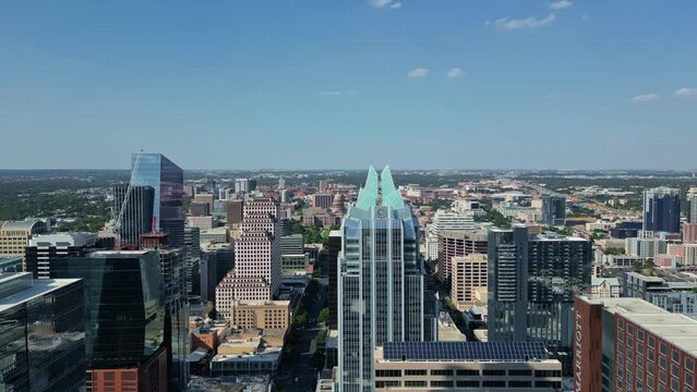 Aerial Reverse reveal from Frost Bank Tower towards the river in  Austin Texas