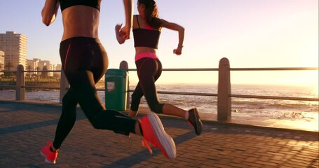 Friends, running and sunset in beach, exercise and fitness for wellness, cardio and training in city. Runners, workout and speed in promenade, young and sprint for health, sport and race together - Powered by Adobe