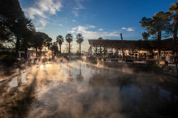 The Antique pool (Cleopatra's Bath) view in Pamukkale. It's a popular touristic destination during...