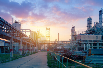 Oil and gas refinery plant or petrochemical industry on sky sunset background, Factory with evening, Manufacturing of petrochemical industrial
