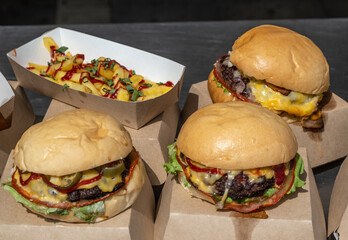 Hamburgers and French fries on the table.
