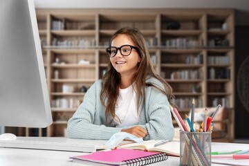 Pretty teen student prepare for exams in library