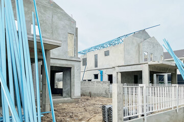 Construction site of property projects during construction show precast housing structure with roof and floor materials. Image use for real estate development presentation background. - 739843694