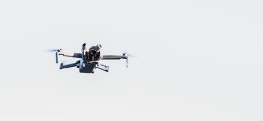 drone fiying white sky background