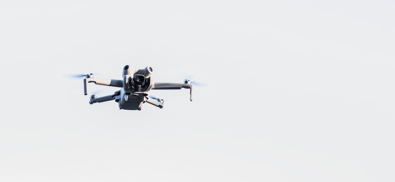 drone fiying white sky background