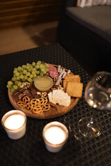 a picnic with wine in the evening on the terrace. romantic dinner with candles and wine