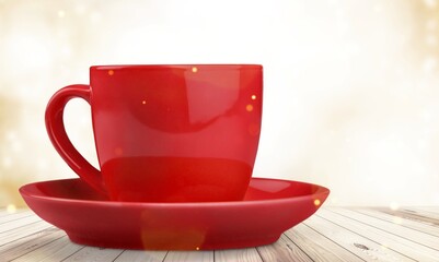 huge ceramic red mug on the desk
