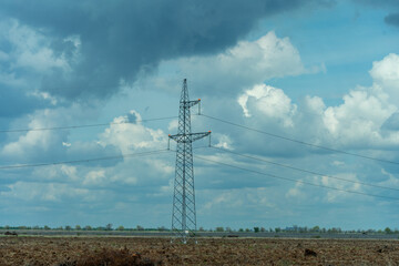 High voltage towers with sky background. Power line support with wires for electricity...