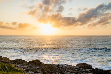 Sun setting at Malin Head, Ireland's northernmost point, Wild Atlantic Way, spectacular coastal route. Numerous Discovery Points. Co. Donegal