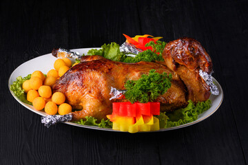 roast duck on a black wooden background
