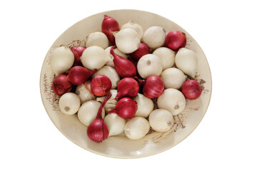 Onion in a ceramic plate isolated on white background. Salad purple and white onion in village bowl. Harvest.