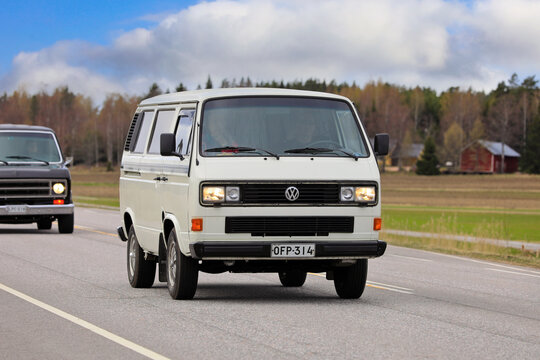 1991 White Volkswagen Type 2 (T3) Transporter camper van on road. The T3 was manufactured in Hannover, Germany 1979-1991. 