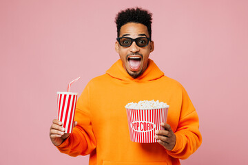 Young man of African American ethnicity wear yellow hoody casual clothes 3d glasses watch movie...