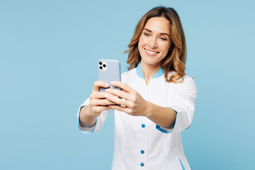 Female smiling doctor woman wears white medical gown suit work in hospital clinic office doing...