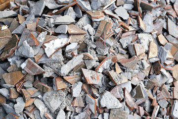 Piles of broken floor tiles from house renovations