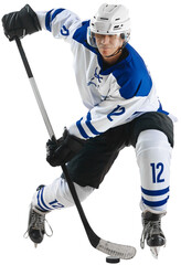 Champion. Young man, hockey player during game, training, playing against transparent background Concept of professional sport, competition, championship, tournament, game and action © Lustre Art Group 