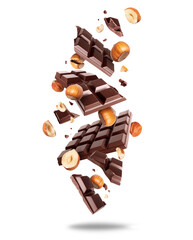 Broken dark chocolate bar with hazelnuts in the air isolated on a white background