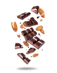 Broken bar of dark chocolate with almonds in the air isolated on a white background