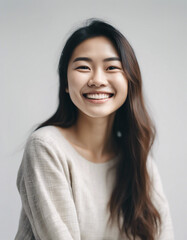 Fototapeta premium Portrait of an Asian young woman with a happy and sincere smile, isolated white background. copy space for text 