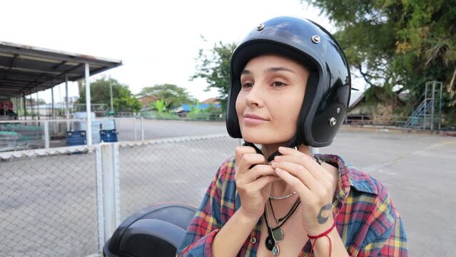Woman Wearing Helmet on Moped in Asia