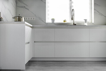 White scandinavian kitchen interior. A modern comfortable kitchen in a minimalist style. Interior design concept