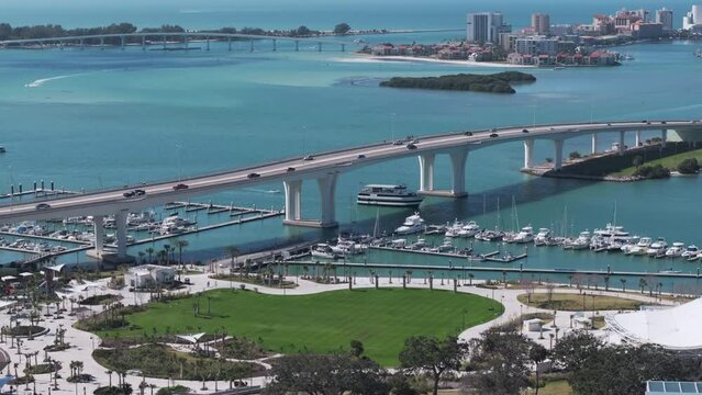 Drone View of Coachman Park in Downtown Clearwater then ascending to follow Causeway to Beach