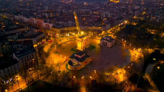 Drone flying at night Arco della Pace. Gate Sempione Porta Sempione city gate to Lombardy in the fall. Arch of Peace. Arco della pace. 