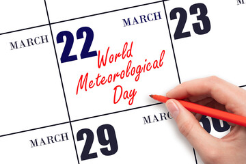 March 22. Hand writing text World Meteorological Day on calendar date. Save the date. Holiday. Day...